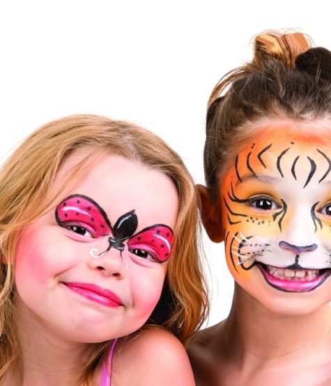 Beautiful young girls with painted faces tiger and ladybug